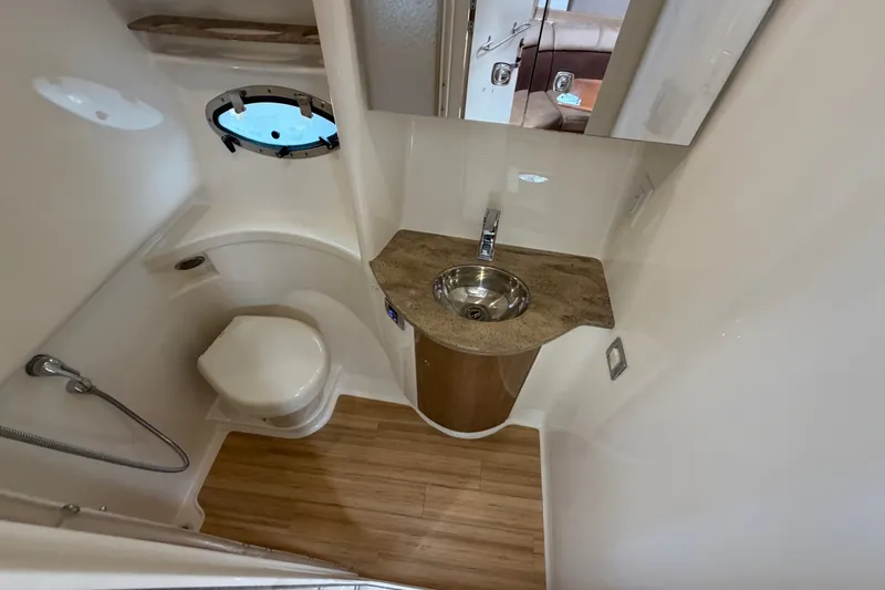 Slide: The Image of 2016 Formula 37 Performance Cruiser bathroom with modern fixtures and wooden flooring. - 28