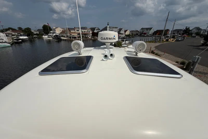 Slide: The Image of 2016 Formula 37 Performance Cruiser with Garmin equipment, docked in a residential marina. - 43
