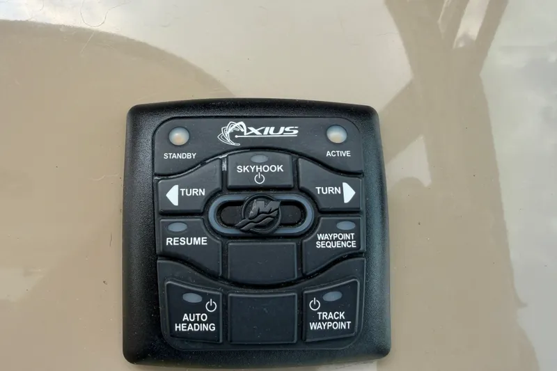 Slide: The Image of Axius control panel on 2016 Formula 37 Performance Cruiser, featuring Skyhook and navigation buttons. - 15