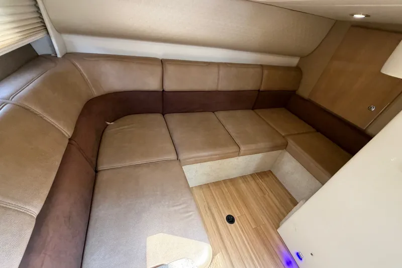 Slide: The Image of Interior of 2016 Formula 37 Performance Cruiser with beige leather seating and wood flooring. - 33