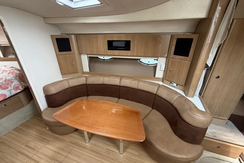 Slide: The Image of Interior of 2016 Formula 37 Performance Cruiser with curved seating and wooden table. - 18