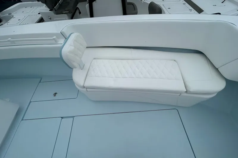 Slide: The Image of Luxurious seating on 2027 Contender 30 ST boat with quilted white upholstery. - 20