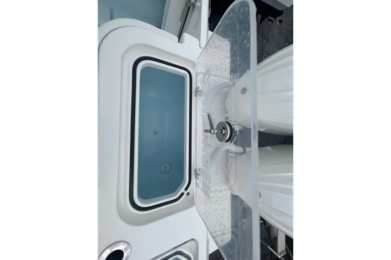 Slide: The Image of Livewell on a 2027 Contender 30 ST boat, featuring a clear lid and modern design. - 27