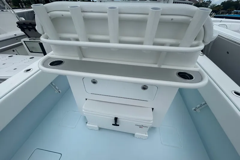 Slide: The Image of 2027 Contender 30 ST boat interior with rod holders and storage compartments. - 15