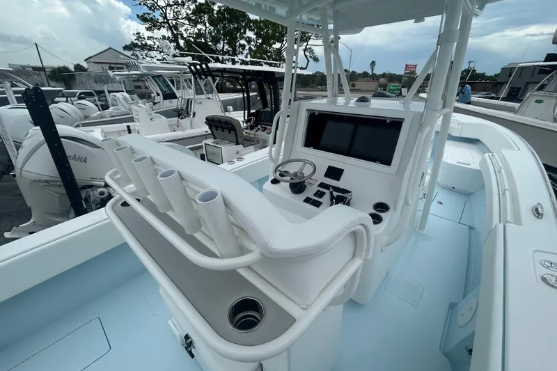 Slide: The Image of 2027 Contender 30 ST boat cockpit with steering wheel and control panel. - 14