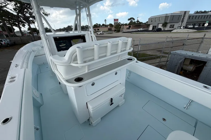 Slide: The Image of 2027 Contender 30 ST boat interior with helm station and rod holders. - 32