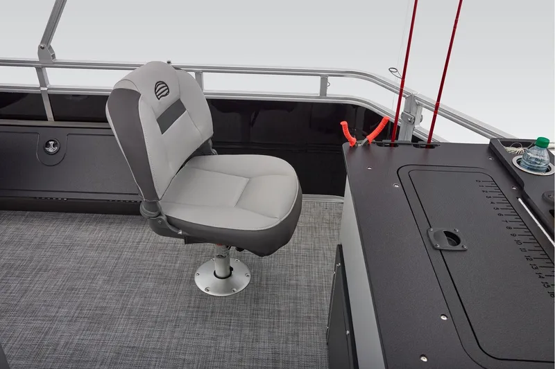 Slide: The Image of Manufacturer Provided Image: 2026 Sun Tracker SportFish 22 DLX boat interior with fishing seat and rod holders. - 60