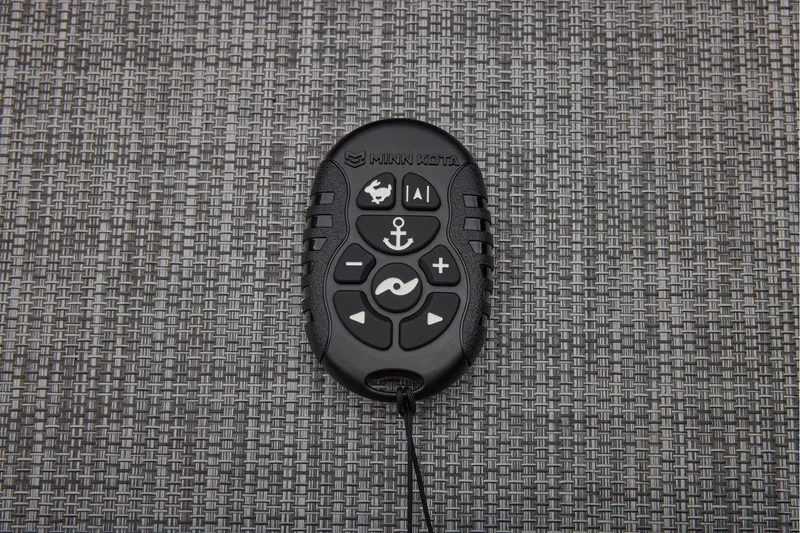 Slide: The Image of Manufacturer Provided Image: Remote control for Minn Kota trolling motor on woven surface, 2026 Sun Tracker SportFish 22 DLX. - 26