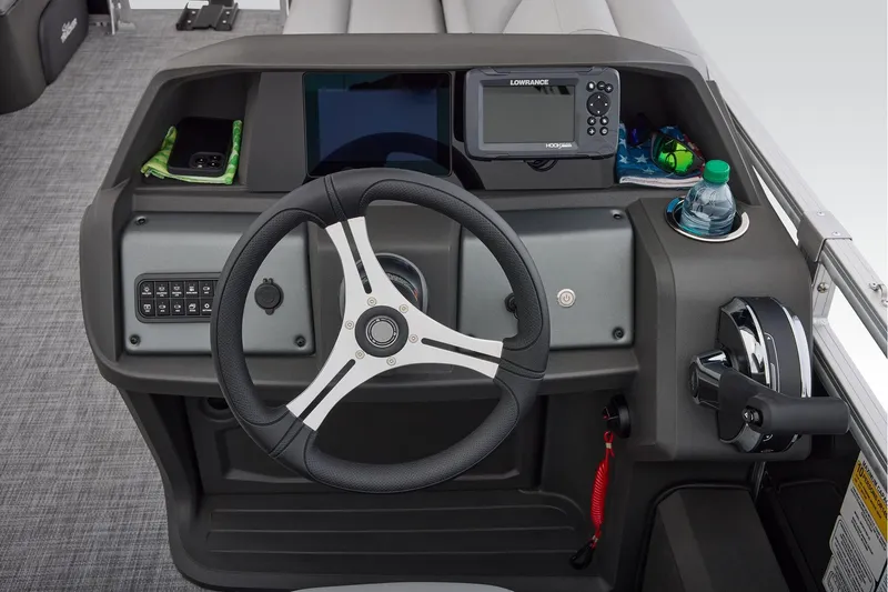 Slide: The Image of Manufacturer Provided Image: 2026 Sun Tracker SportFish 22 DLX dashboard with steering wheel, controls, and navigation system. - 35