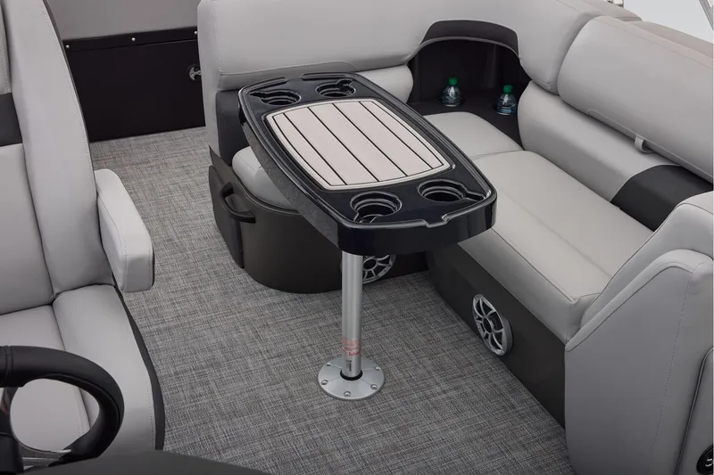 Slide: The Image of Manufacturer Provided Image: Interior of 2026 Sun Tracker SportFish 22 DLX with seating and table. - 43