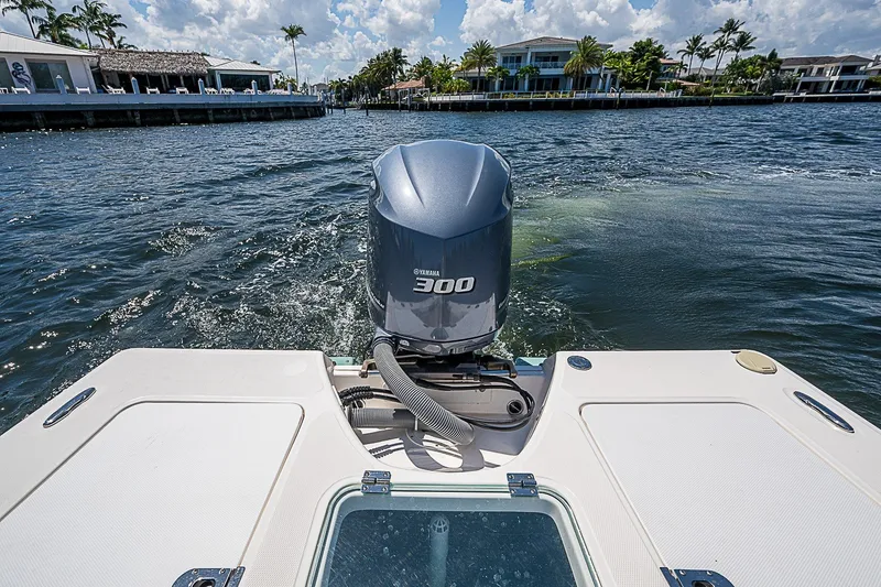 Slide: The Image of 2012 Everglades 243 Center Console boat with Yamaha 300 engine on a sunny waterway. - 15