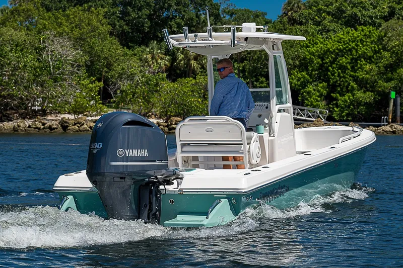 Slide: The Image of 2012 Everglades 243 Center Console boat with Yamaha engine on water. - 51