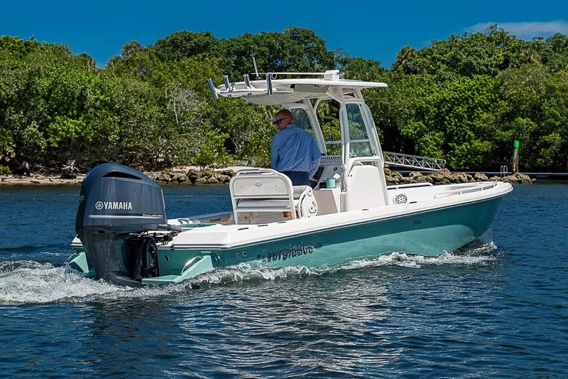 Slide: The Image of 2012 Everglades 243 Center Console boat cruising on a sunny day with Yamaha engine. - 50