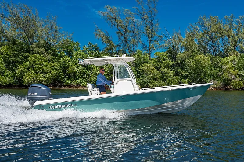 Slide: The Image of 2012 Everglades 243 Center Console boat cruising on a scenic waterway. - 46