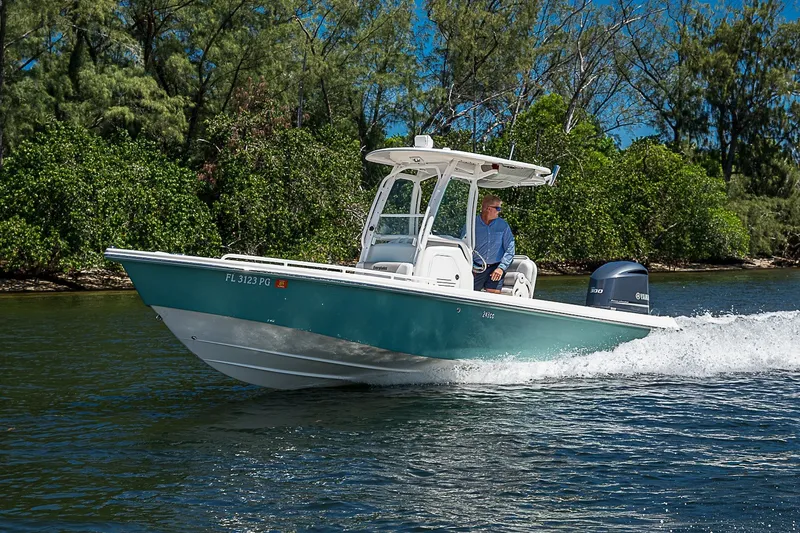 Slide: The Image of 2012 Everglades 243 Center Console boat cruising on a sunny day. - 55
