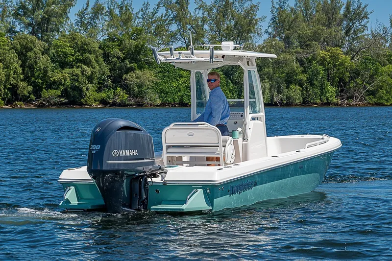 Slide: The Image of 2012 Everglades 243 Center Console boat on water, featuring Yamaha engine. - 36