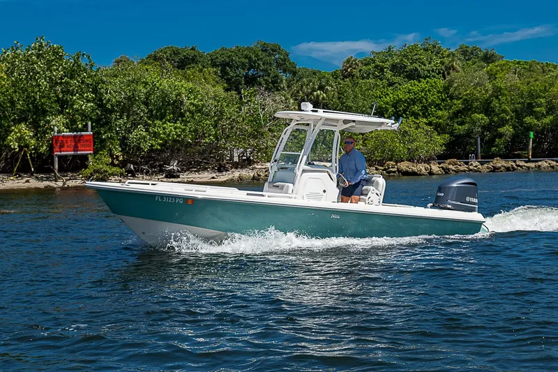 Slide: The Image of 2012 Everglades 243 Center Console boat cruising on a sunny day. - 52