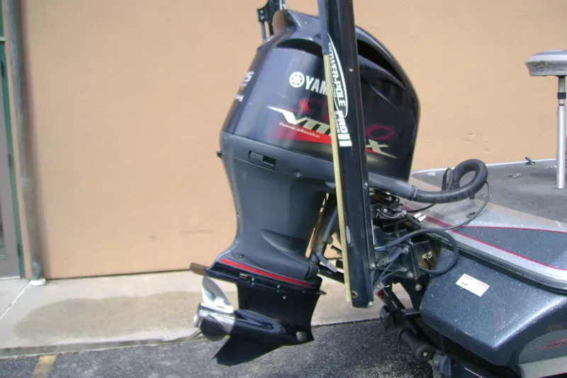 Slide: The Image of 2016 Skeeter ZX225 boat with Yamaha VMAX outboard motor, parked on pavement. - 7