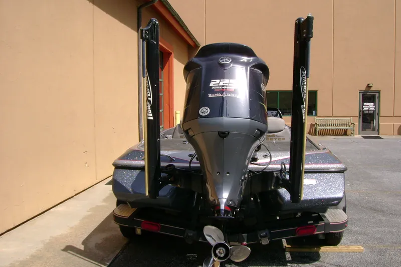 Slide: The Image of 2016 Skeeter ZX225 boat rear view with motor and Power-Pole anchors. - 3