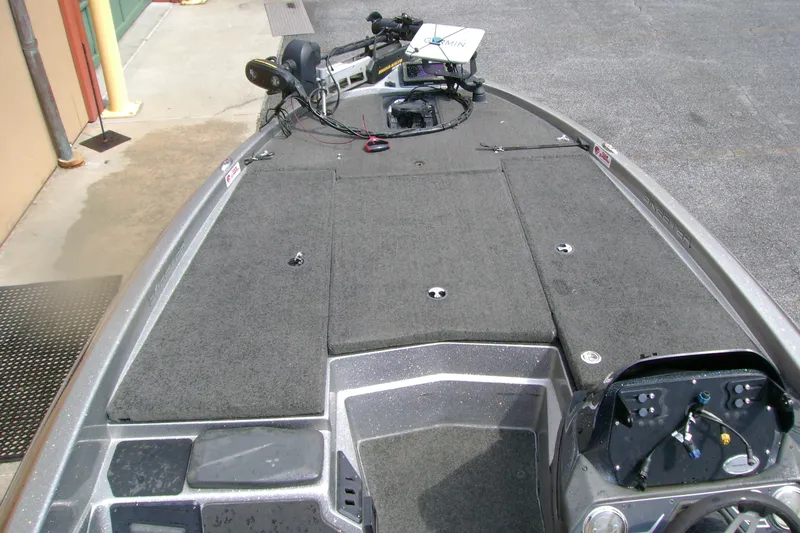Slide: The Image of 2016 Skeeter ZX225 bass boat deck with trolling motor and control panel. - 2
