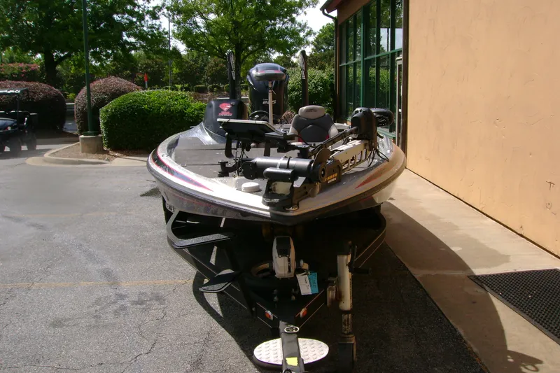 Slide: The Image of 2016 Skeeter ZX225 bass boat parked outdoors on a sunny day. - 5