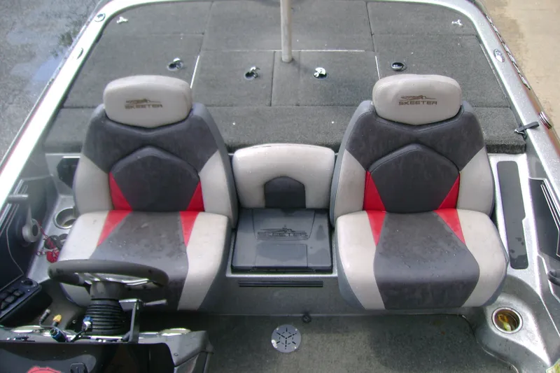 Slide: The Image of 2016 Skeeter ZX225 boat interior with dual seats and steering wheel. - 9