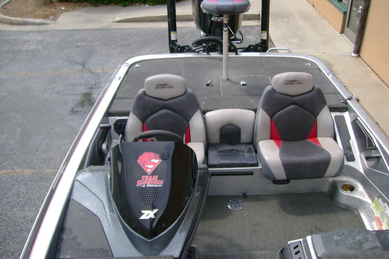 Slide: The Image of 2016 Skeeter ZX225 boat interior with dual seats and steering console. - 8