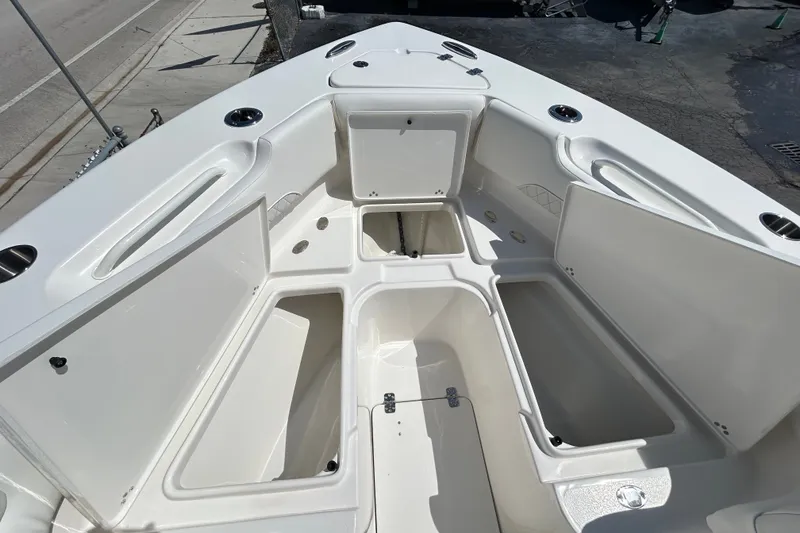 Slide: The Image of 2026 Key West 249 FS boat interior with open storage compartments, showcasing spacious design. - 20