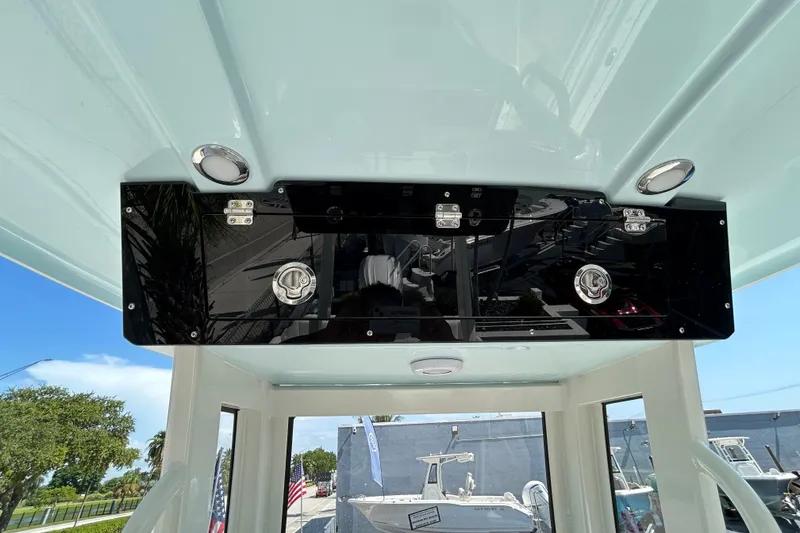Slide: The Image of 2026 Key West 249 FS boat interior with sleek black overhead console. - 18