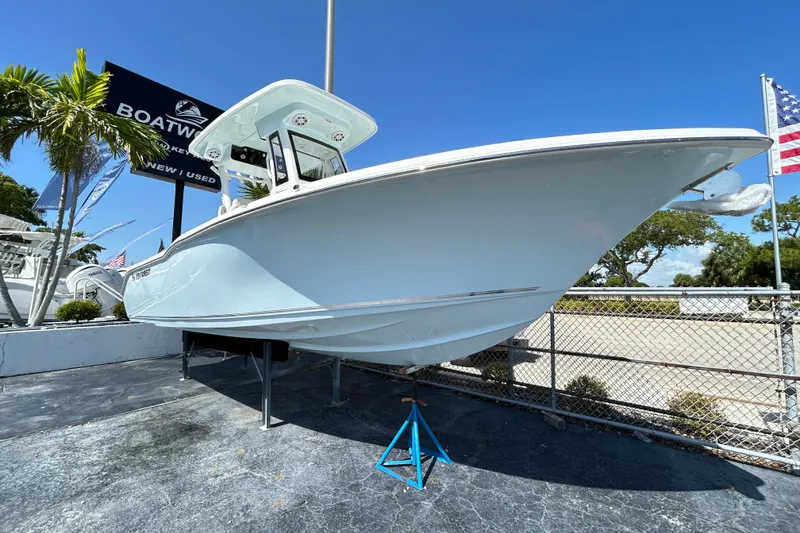 The Image of 2026 Key West 249 FS boat displayed outdoors under clear blue sky. - 0