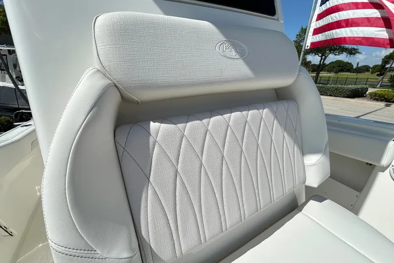 Slide: The Image of 2026 Key West 249 FS boat seat with American flag in background. - 11