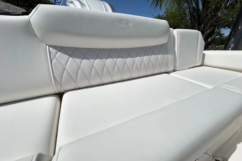 Slide: The Image of Luxurious white seating on 2026 Key West 249 FS boat, featuring diamond stitching. - 22