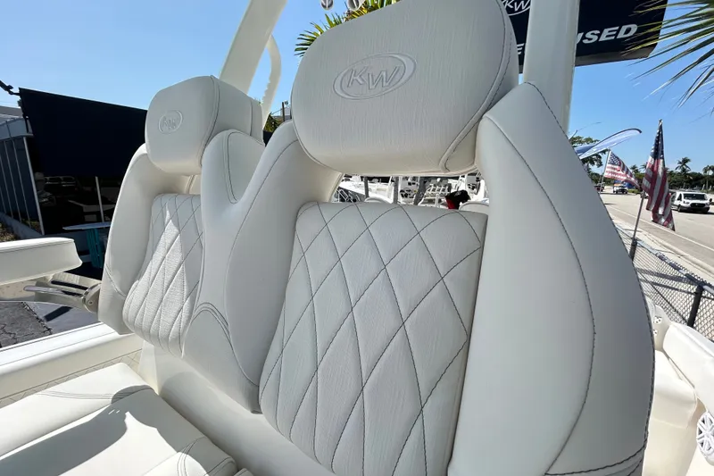 Slide: The Image of 2026 Key West 249 FS boat seats with diamond stitching and KW logo. - 14