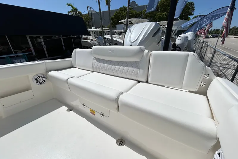 Slide: The Image of 2026 Key West 249 FS boat with luxurious white seating and modern design. - 23