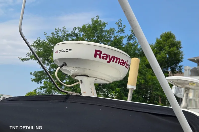 Slide: The Image of Raymarine HD Color radar on 2001 Cruisers Yachts 3470 Express, with trees and blue sky background. - 3