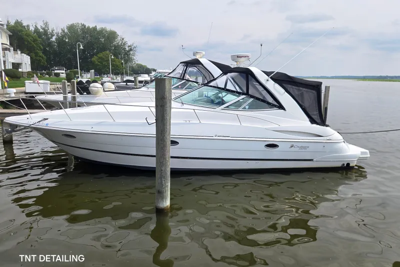 Slide: The Image of 2001 Cruisers Yachts 3470 Express docked in a marina, side view. - 2