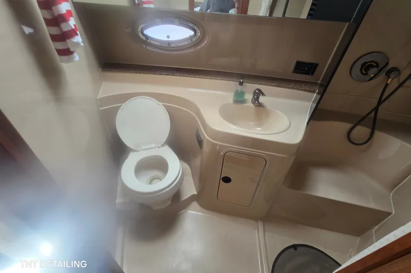 Slide: The Image of Bathroom interior of 2001 Cruisers Yachts 3470 Express with toilet and sink. - 12