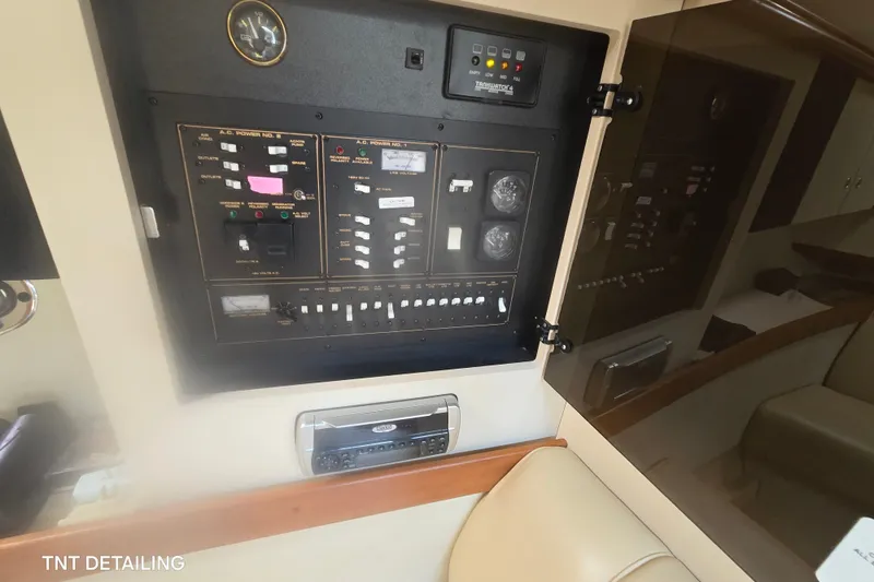 Slide: The Image of Electrical control panel inside 2001 Cruisers Yachts 3470 Express boat cabin. - 13