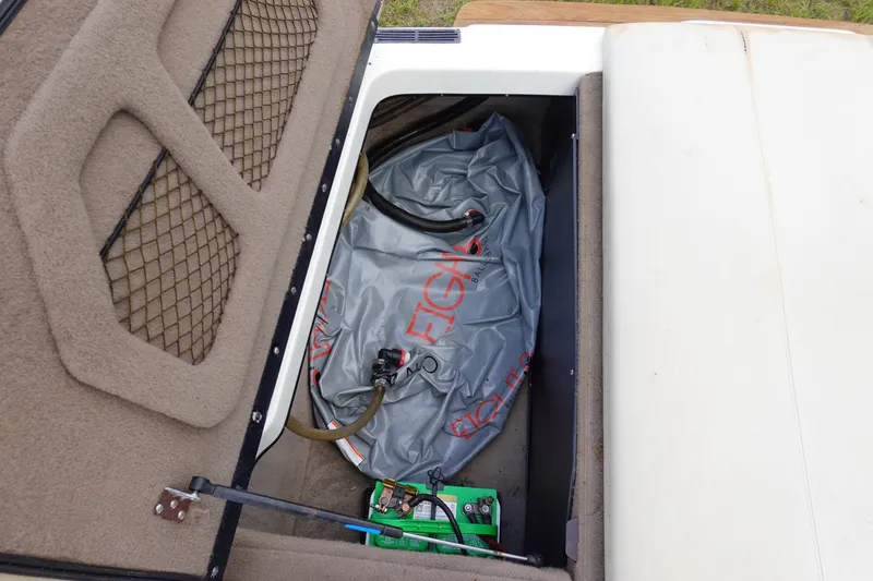Slide: The Image of Storage compartment of a 2000 Malibu Wakesetter 23 LSV with ballast bag and battery. - 19