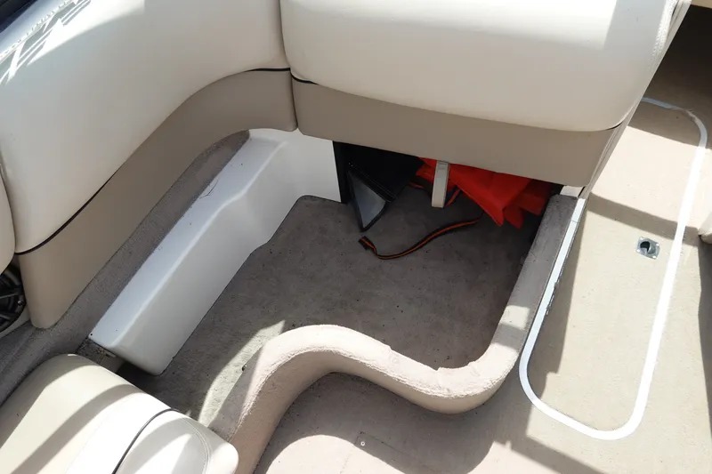 Slide: The Image of Interior of 2000 Malibu Wakesetter 23 LSV boat showing seating and storage area. - 12