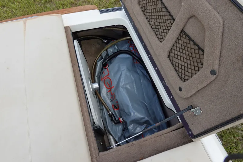 Slide: The Image of Ballast compartment of a 2000 Malibu Wakesetter 23 LSV, featuring a ballast bag and hoses. - 20