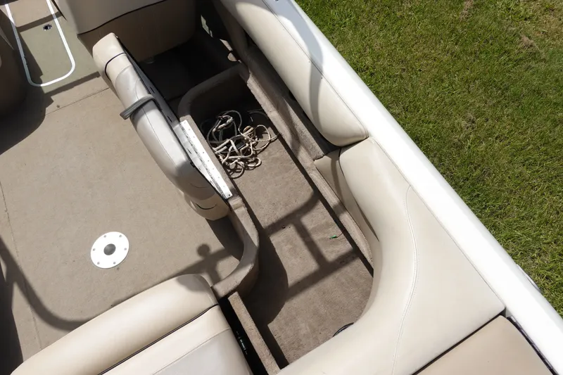 Slide: The Image of Interior of a 2000 Malibu Wakesetter 23 LSV boat with open storage compartment. - 10