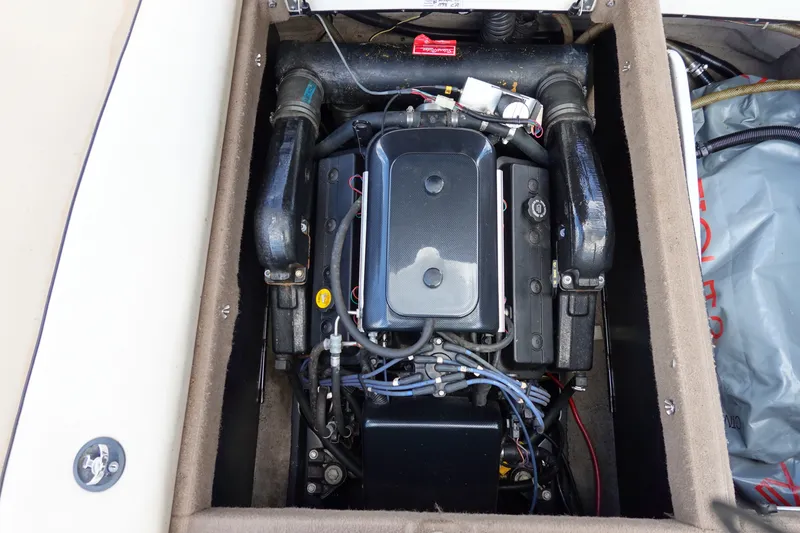 Slide: The Image of Engine compartment of a 2000 Malibu Wakesetter 23 LSV boat, showcasing detailed components. - 21