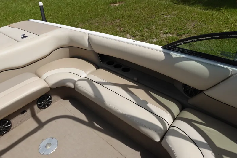 Slide: The Image of Interior of 2000 Malibu Wakesetter 23 LSV boat with beige seating and cup holders. - 8