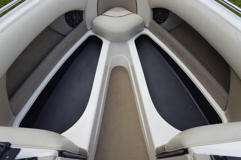 Slide: The Image of Interior of a 2000 Malibu Wakesetter 23 LSV boat, featuring seating and storage. - 18