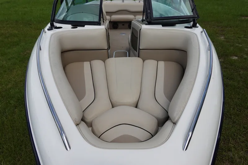 Slide: The Image of 2000 Malibu Wakesetter 23 LSV boat interior with beige seating and windshield. - 17