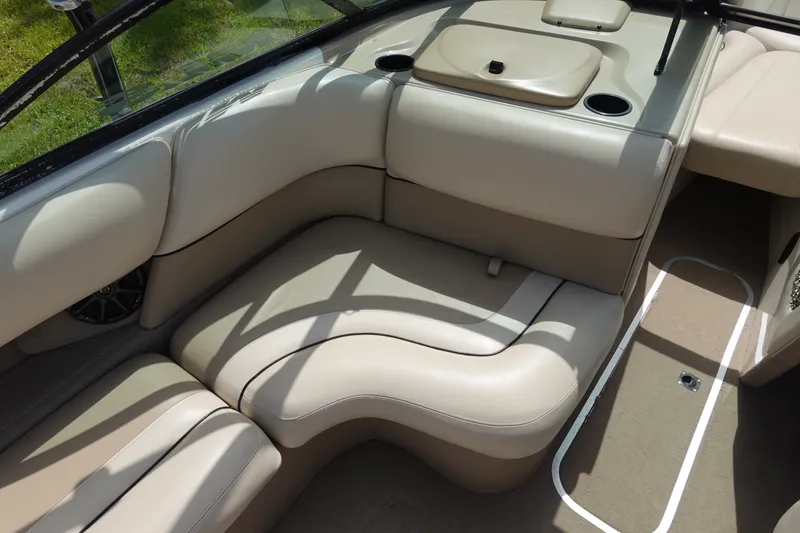 Slide: The Image of Interior of 2000 Malibu Wakesetter 23 LSV boat with beige seating and carpet. - 9