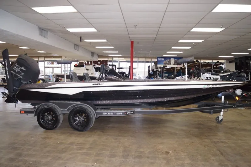 The Image of 2023 Skeeter ZXR21 boat displayed indoors on a trailer. - 3