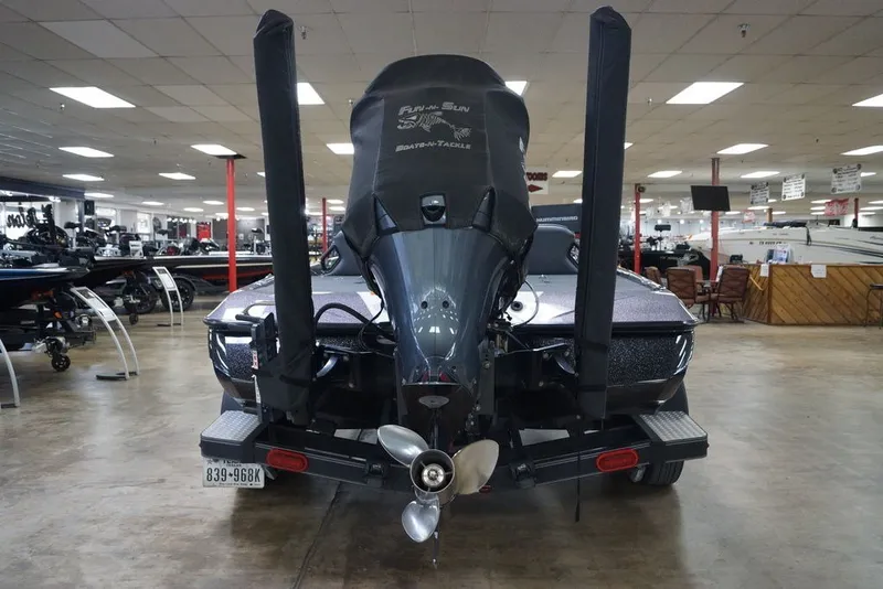 Slide: The Image of 2023 Skeeter ZXR21 boat displayed indoors, showcasing rear motor and propeller. - 7