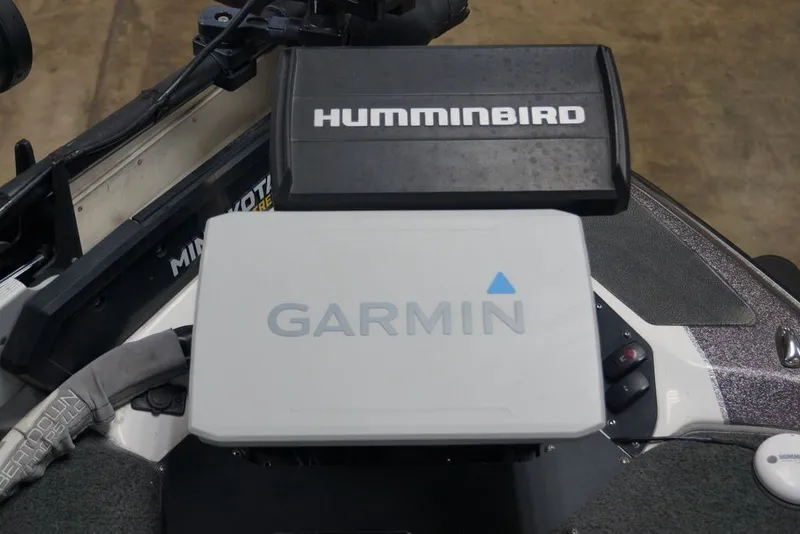 Slide: The Image of 2023 Skeeter ZXR21 boat with Garmin and Humminbird electronics on the dashboard. - 13